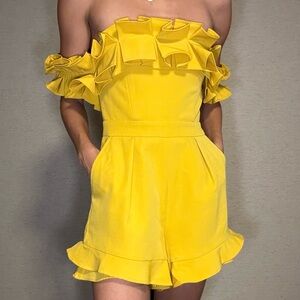 Yellow ruffled off the shoulder romper with pockets